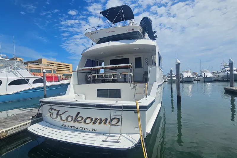 Slide: The Image of 1990 Hatteras 67 Cockpit Motor Yacht docked in Atlantic City marina. - 5
