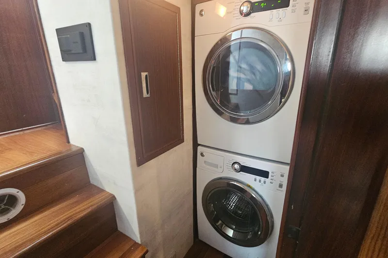 Slide: The Image of Stacked washer and dryer in 1990 Hatteras 67 Cockpit Motor Yacht interior. - 55