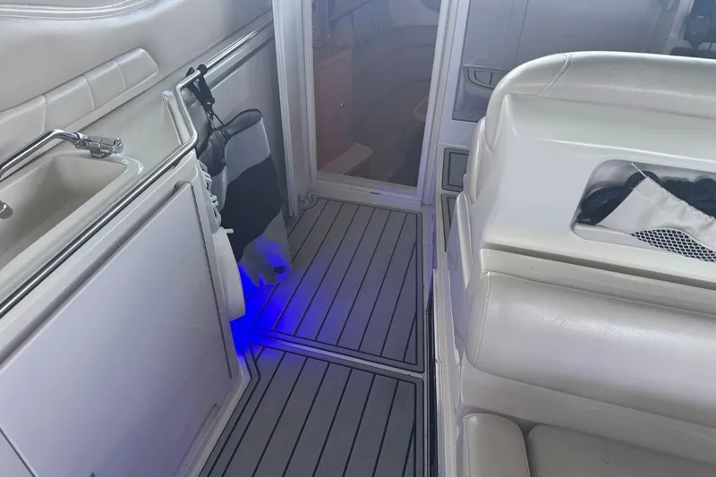 Slide: The Image of Interior of 2000 Regal Commodore 3260 boat with sink and seating area. - 30