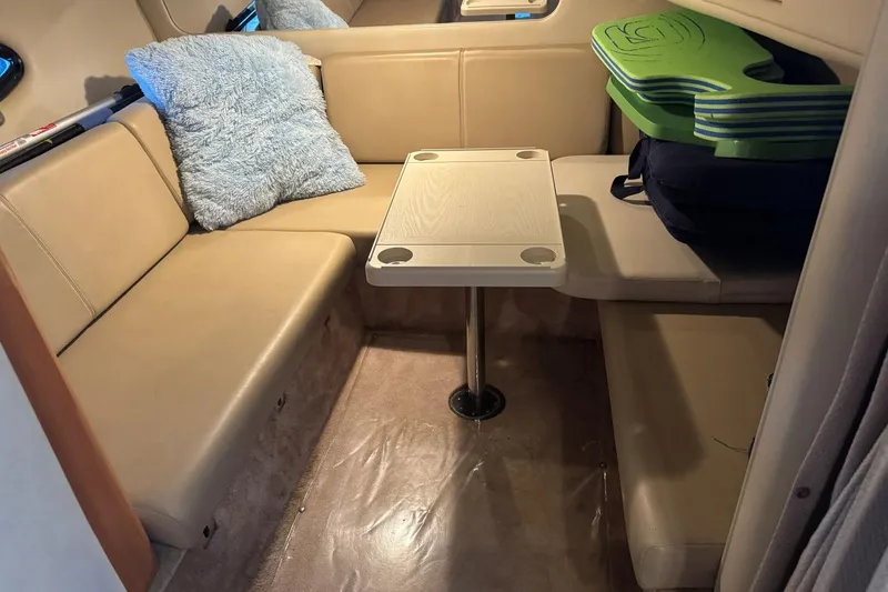 Slide: The Image of Interior of 2000 Regal Commodore 3260 with beige seating and table. - 39