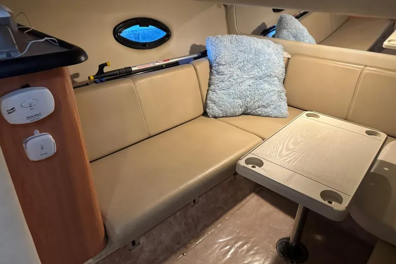 Slide: The Image of Interior of 2000 Regal Commodore 3260 with beige seating and table. - 40