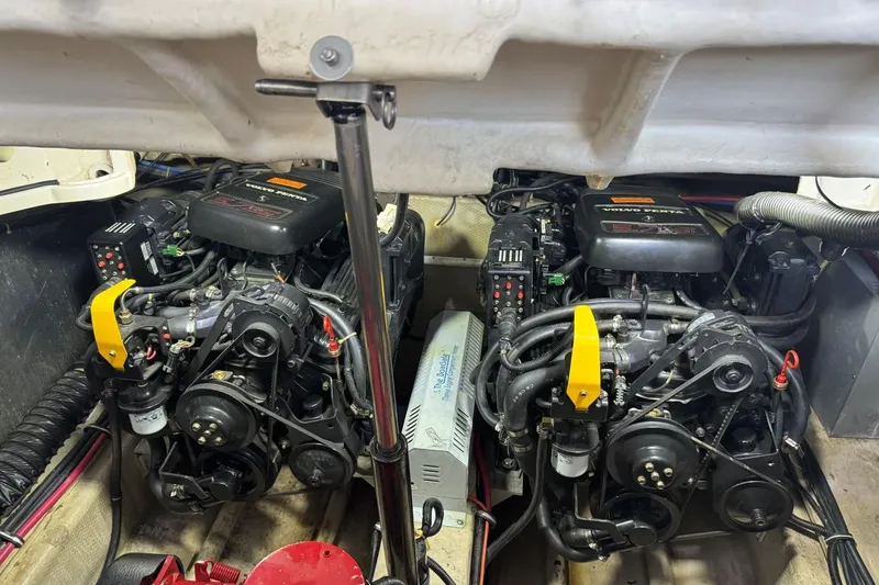 Slide: The Image of Engine compartment of a 2000 Regal Commodore 3260 boat, featuring dual engines. - 43