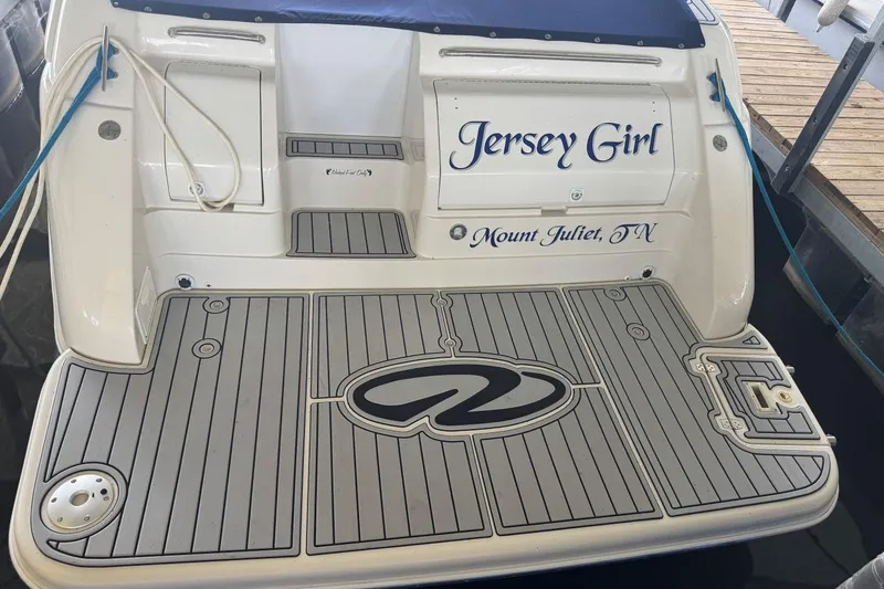 Slide: The Image of Rear view of 2000 Regal Commodore 3260 boat named "Jersey Girl" in dock. - 51