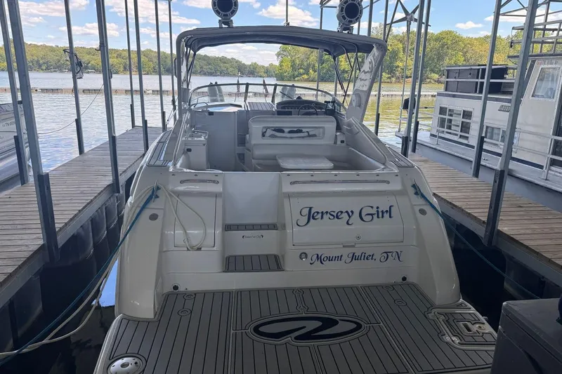 Slide: The Image of 2000 Regal Commodore 3260 boat named "Jersey Girl" docked at marina. - 8