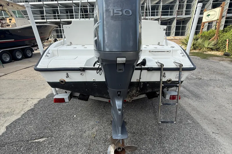Slide: The Image of 2002 Boston Whaler 180 Dauntless boat with Yamaha 150 outboard motor, rear view. - 8