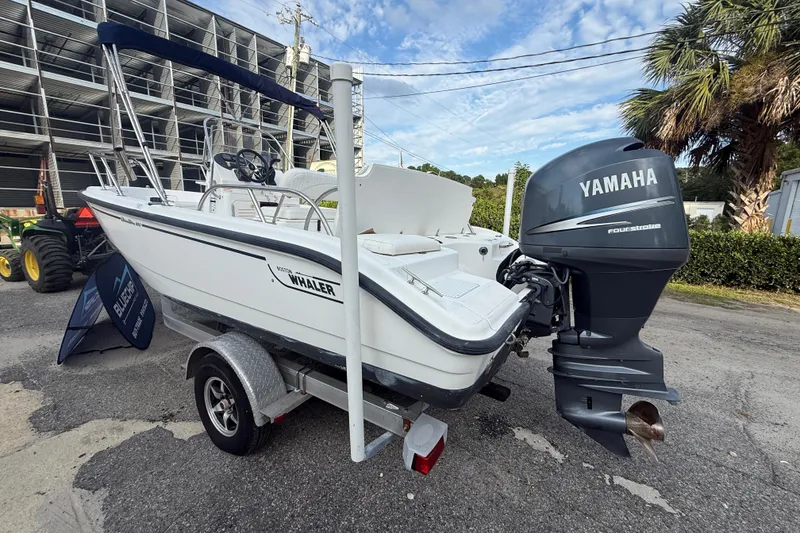 Slide: The Image of 2002 Boston Whaler 180 Dauntless boat with Yamaha outboard motor on trailer. - 9
