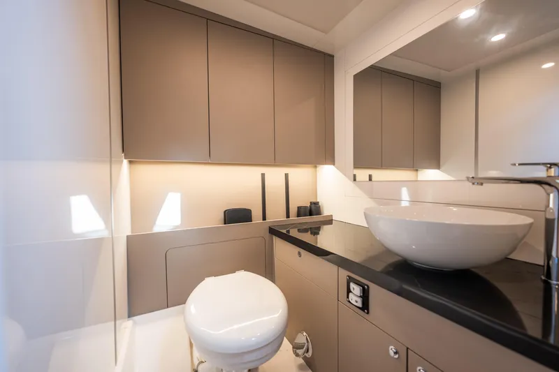 Slide: The Image of Modern bathroom with sleek fixtures, vessel sink, and ambient lighting. - 18