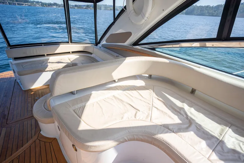 Slide: The Image of Luxurious interior of 2018 Cobalt 46 Yacht with cream seating and panoramic windows. - 11