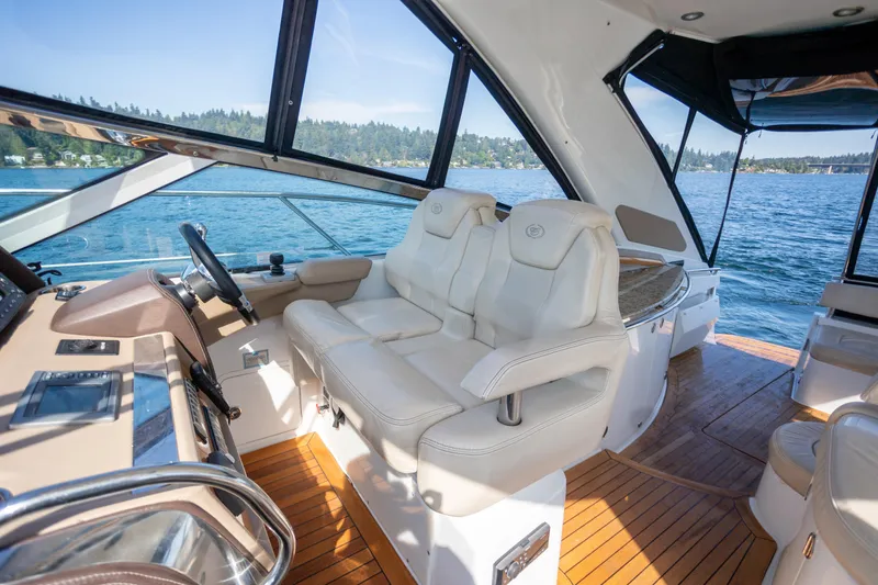 Slide: The Image of Luxurious interior of 2018 Cobalt 46 Yacht with plush seating and scenic water view. - 12