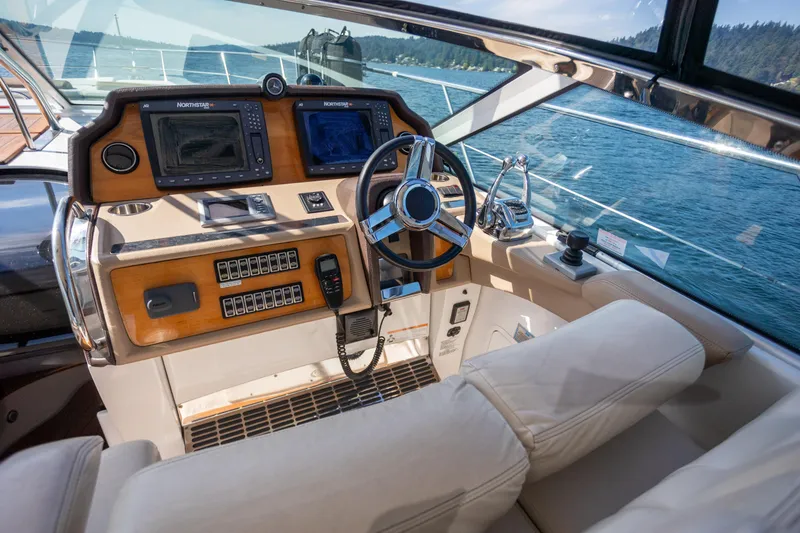 Slide: The Image of Helm of 2018 Cobalt 46 Yacht with modern navigation equipment and luxurious seating. - 13
