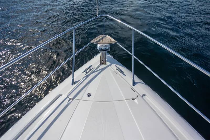 Slide: The Image of Bow view of 2018 Cobalt 46 Yacht on open water. - 31