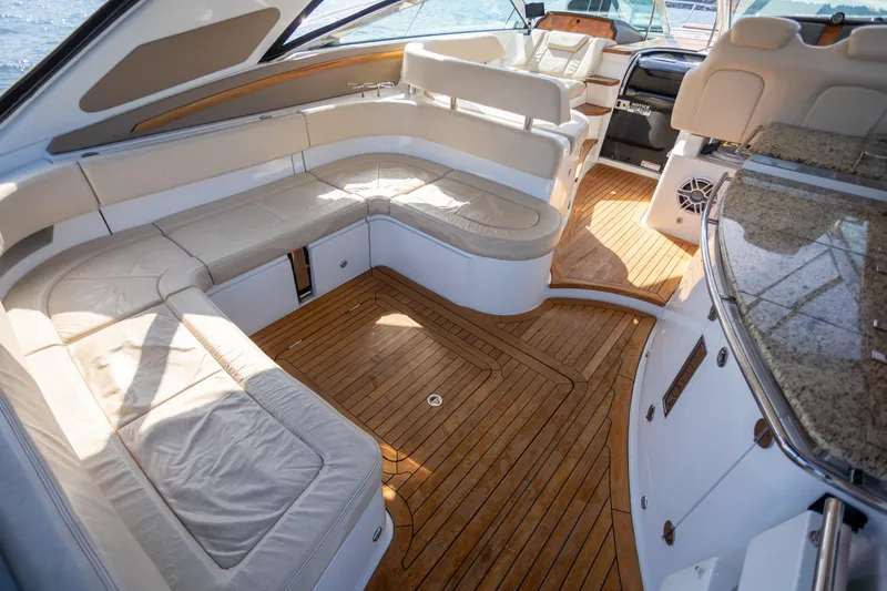 Slide: The Image of Luxurious interior of 2018 Cobalt 46 Yacht with plush seating and wooden flooring. - 5