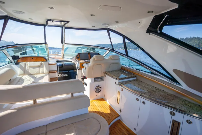 Slide: The Image of Luxurious interior of 2018 Cobalt 46 Yacht with elegant seating and scenic water view. - 7