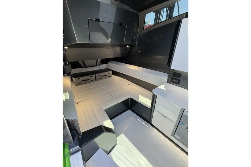 Slide: The Image of Modern interior of 2023 Adrenaline 47 boat with sleek design and comfortable seating. - 11