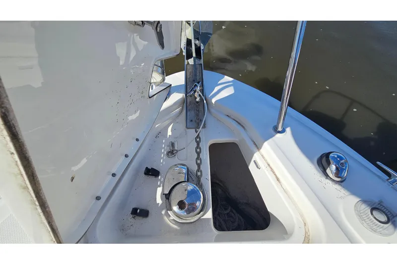 Slide: The Image of 2015 Sea Ray 260 Sundancer anchor compartment with chain and winch. - 15
