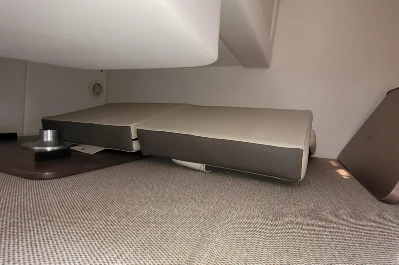 Slide: The Image of Interior cabin of 2015 Sea Ray 260 Sundancer with cushioned seating. - 21