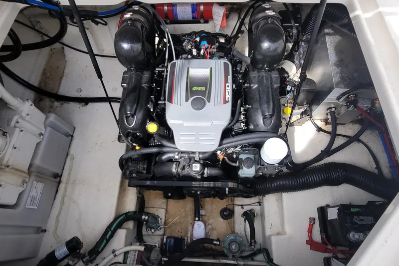 Slide: The Image of Engine compartment of a 2015 Sea Ray 260 Sundancer boat, featuring a 350 MAG engine. - 29