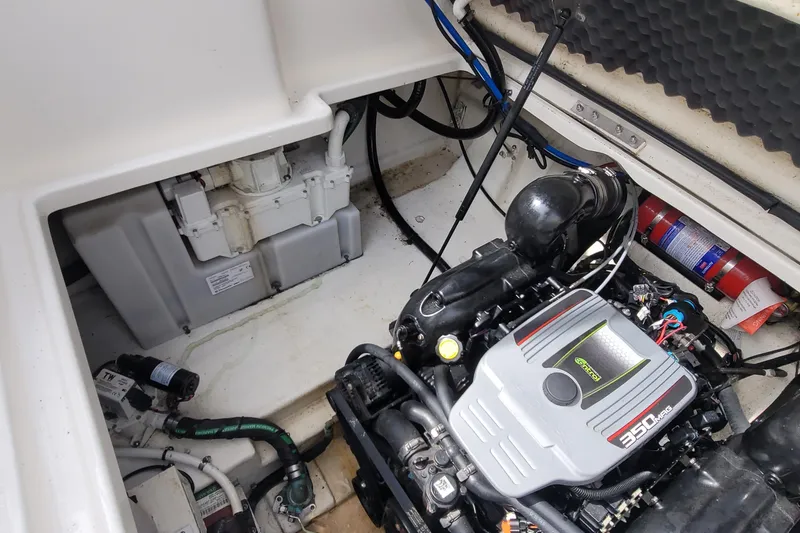 Slide: The Image of Engine compartment of a 2015 Sea Ray 260 Sundancer boat, featuring a 350 MAG engine. - 30
