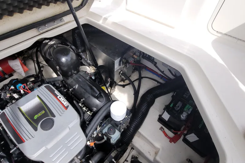 Slide: The Image of Engine compartment of 2015 Sea Ray 260 Sundancer boat, showcasing mechanical components. - 31