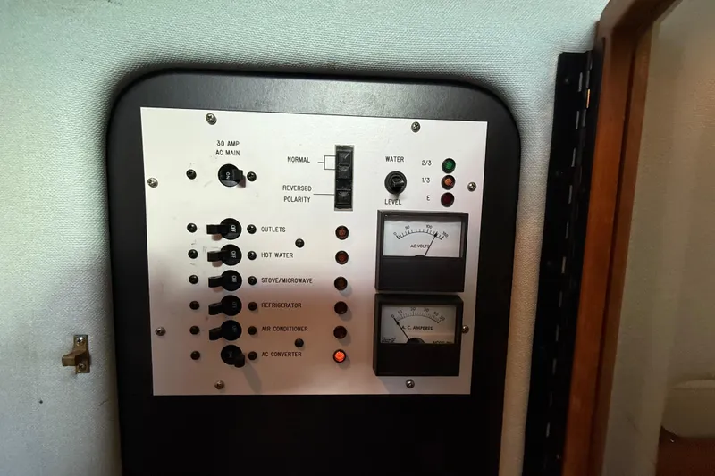 Slide: The Image of Electrical control panel on a 1989 Sea Ray 300 Weekender boat. - 26