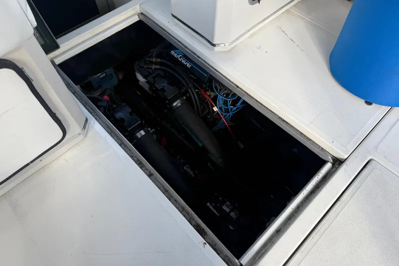 Slide: The Image of Engine compartment of 1989 Sea Ray 300 Weekender boat, featuring MerCruiser components. - 28