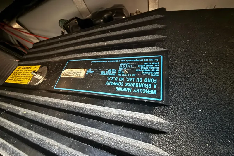 Slide: The Image of Engine compartment of 1989 Sea Ray 300 Weekender with Mercury Marine label. - 31