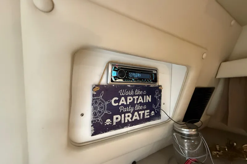 Slide: The Image of Interior of 2002 Regal Commodore 2860 with stereo and pirate-themed sign. - 21