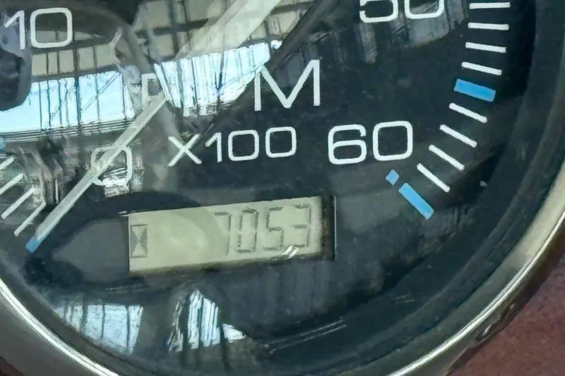 Slide: The Image of Close-up of a Regal Commodore 2860 tachometer, displaying 7053 RPM. - 24