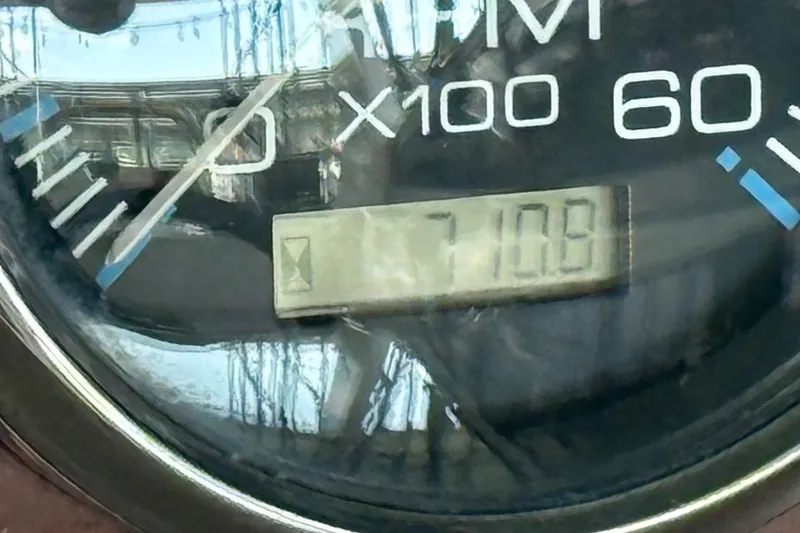 Slide: The Image of Close-up of RPM gauge on 2002 Regal Commodore 2860, displaying 710.8 hours. - 25