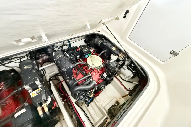 Slide: The Image of Engine compartment of a 2002 Regal Commodore 2860 boat, showcasing mechanical components. - 27