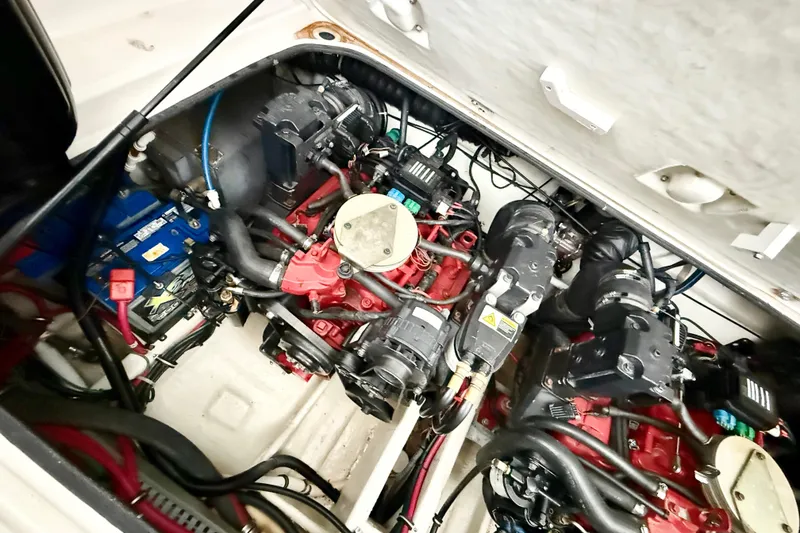 Slide: The Image of Engine compartment of a 2002 Regal Commodore 2860 boat, showcasing dual engines and wiring. - 28