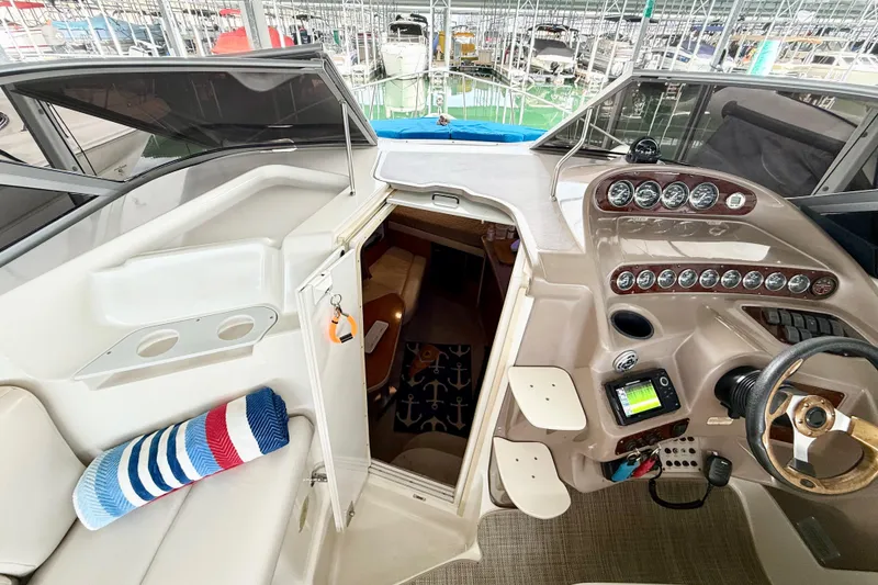 Slide: The Image of 2002 Regal Commodore 2860 boat interior with helm, gauges, and cabin entrance. - 6