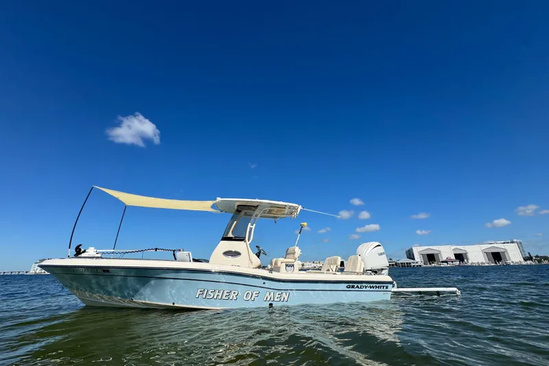 The Image of 2023 Grady-White 251 Coastal Explorer boat on water under clear blue sky. - 0