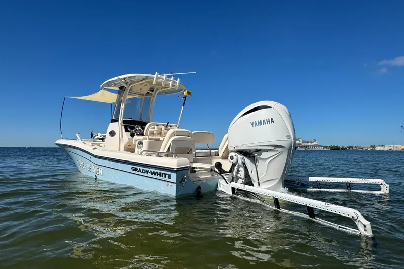 Slide: The Image of 2023 Grady-White 251 Coastal Explorer boat with Yamaha engine on calm water. - 1