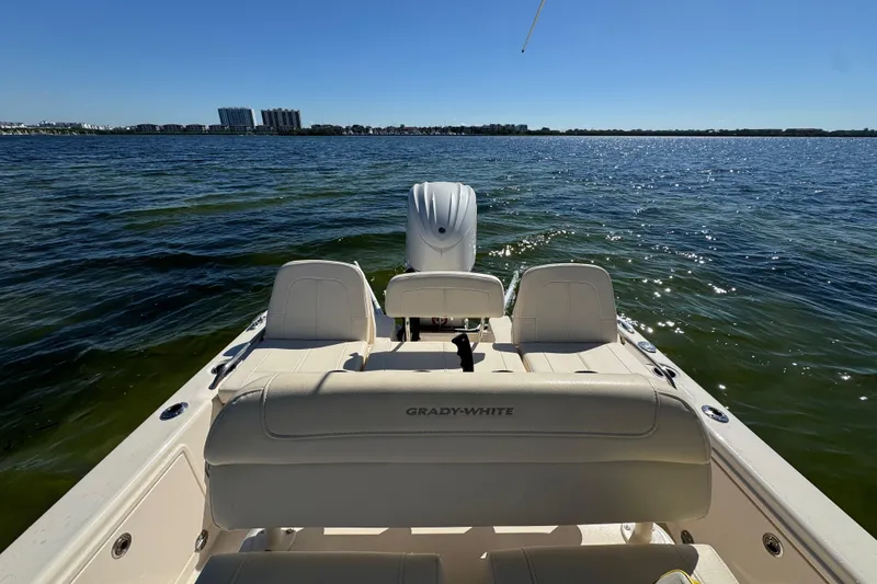 Slide: The Image of 2023 Grady-White 251 Coastal Explorer boat on open water, sunny day. - 13