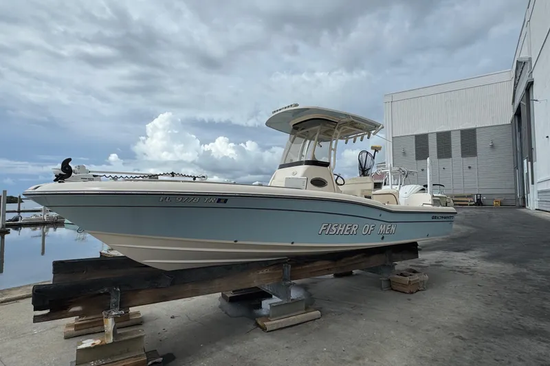 Slide: The Image of 2023 Grady-White 251 Coastal Explorer boat on dock, cloudy sky background. - 15