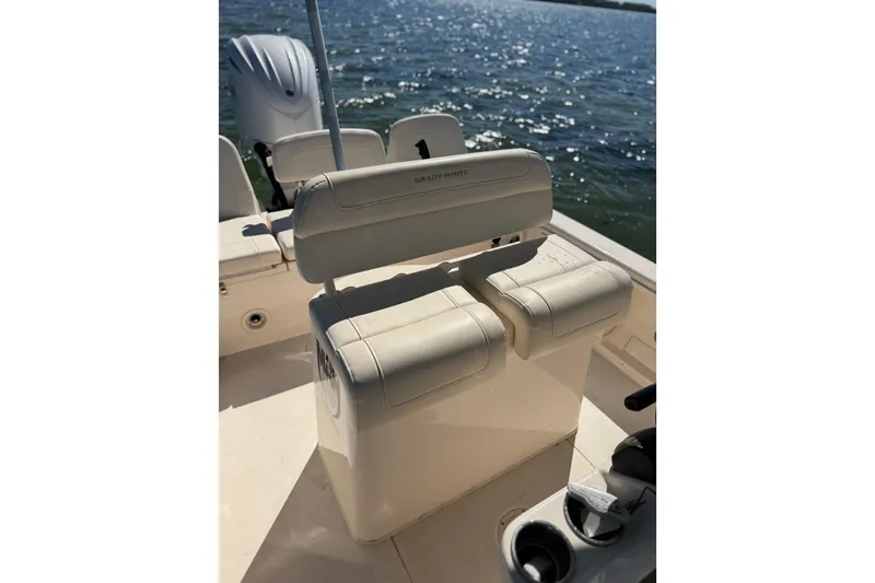 Slide: The Image of 2023 Grady-White 251 Coastal Explorer boat interior with seating, on a sunny day at sea. - 8