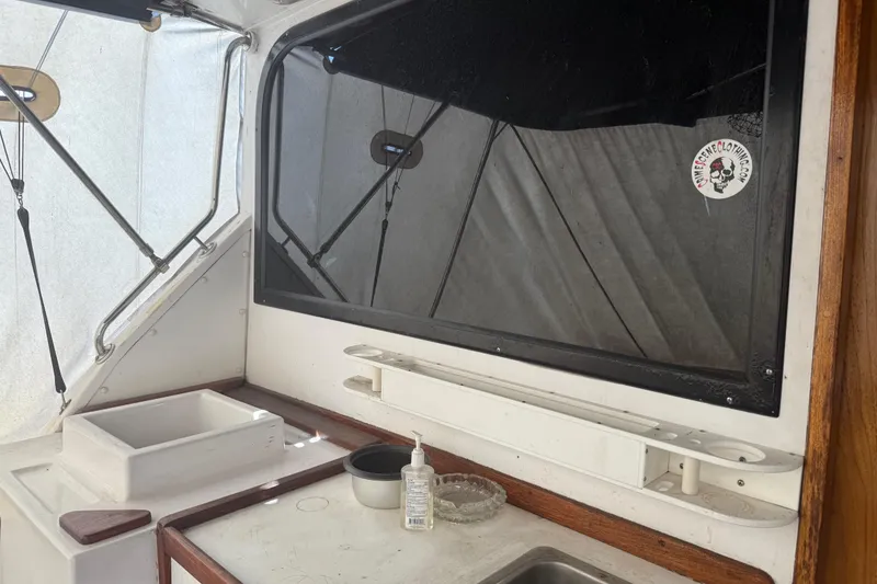 Slide: The Image of Interior of 1974 Pacemaker 48 Sportfisherman boat with sink and window. - 19