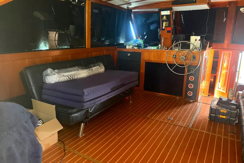 Slide: The Image of Interior of a 1974 Pacemaker 48 Sportfisherman with wooden flooring and steering wheel. - 21