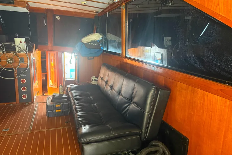 Slide: The Image of Interior of 1974 Pacemaker 48 Sportfisherman with leather seating and wooden paneling. - 22