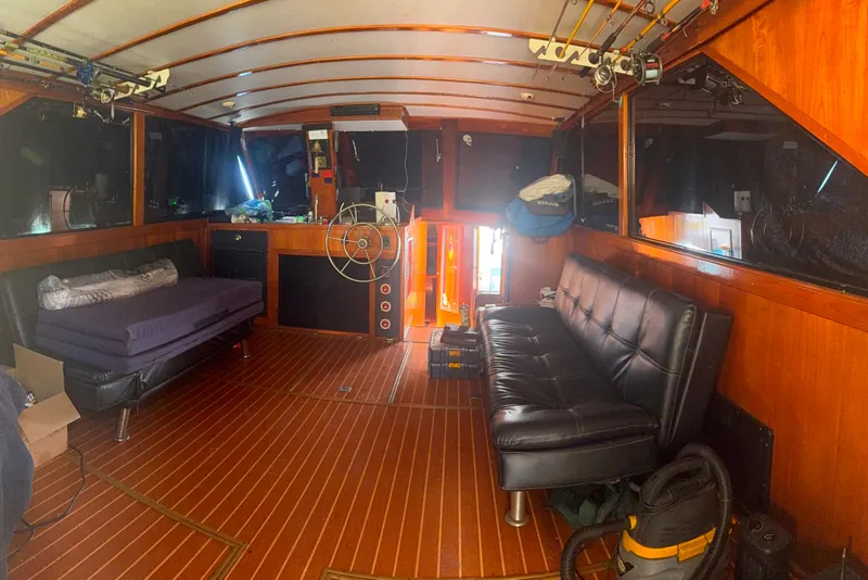 Slide: The Image of Interior of a 1974 Pacemaker 48 Sportfisherman with wooden paneling and seating. - 23