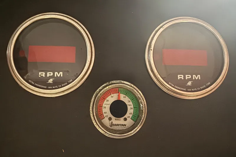 Slide: The Image of 1974 Pacemaker 48 Sportfisherman dashboard with RPM and pressure gauges. - 30