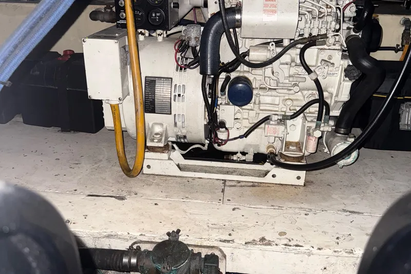 Slide: The Image of Engine room of a 1974 Pacemaker 48 Sportfisherman boat, showcasing mechanical components. - 38