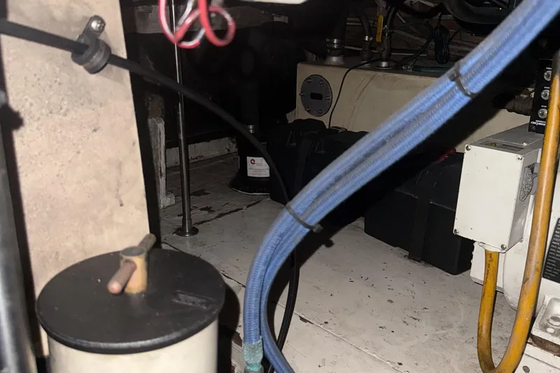 Slide: The Image of Engine room of a 1974 Pacemaker 48 Sportfisherman with visible cables and equipment. - 39