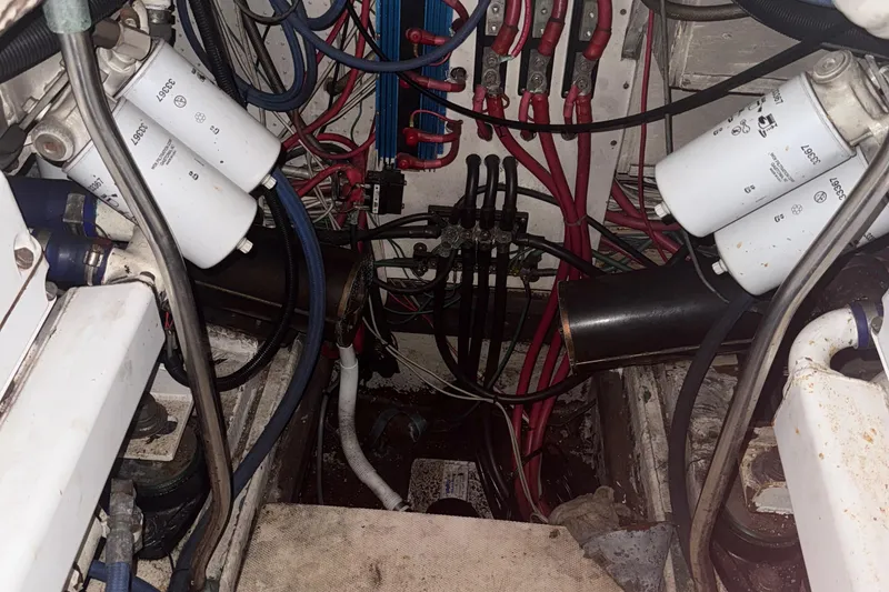 Slide: The Image of Engine room of 1974 Pacemaker 48 Sportfisherman with filters and wiring visible. - 41