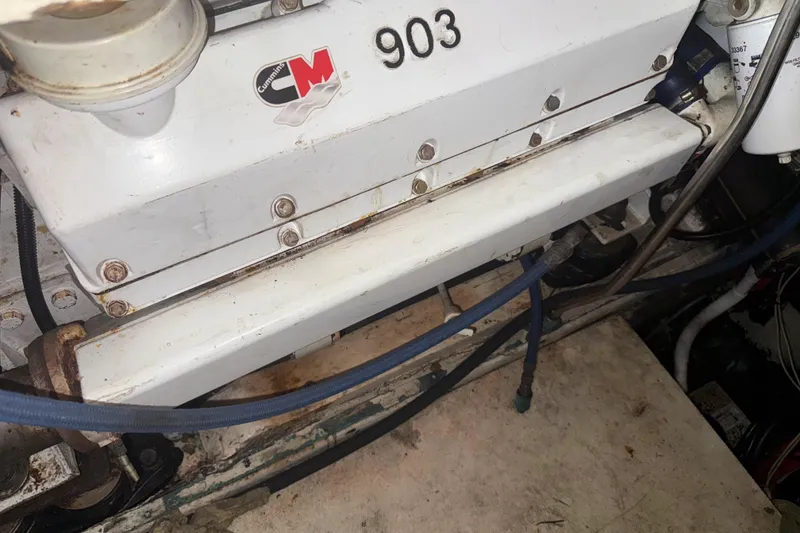 Slide: The Image of Engine compartment of a 1974 Pacemaker 48 Sportfisherman boat, featuring Cummins components. - 42