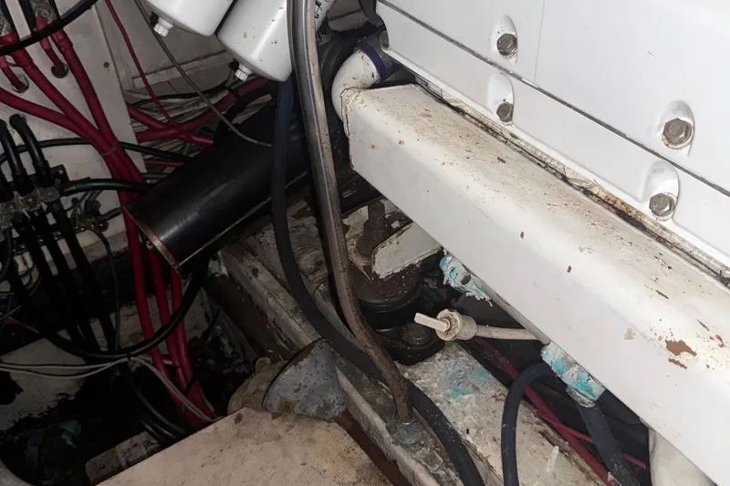 Slide: The Image of Engine room of a 1974 Pacemaker 48 Sportfisherman with visible wiring and components. - 44