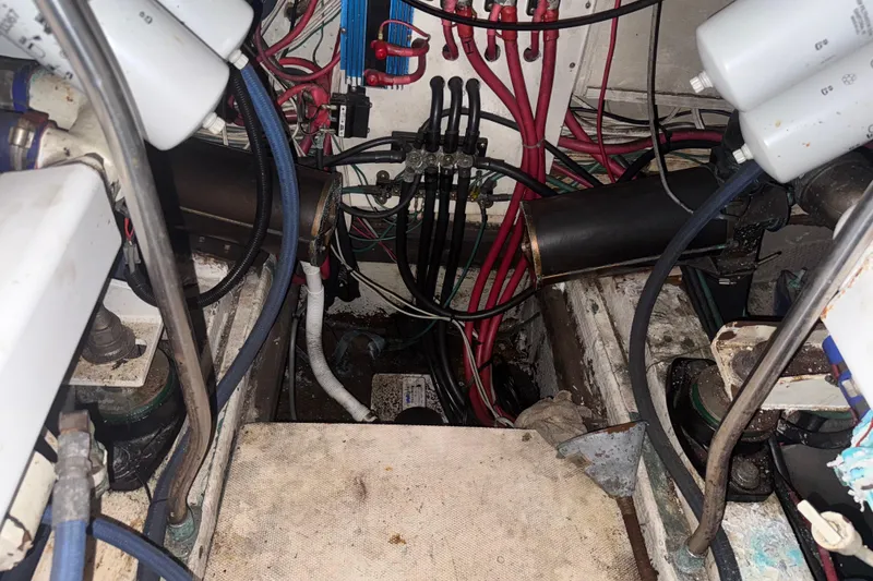 Slide: The Image of Engine room of a 1974 Pacemaker 48 Sportfisherman with visible wiring and components. - 45