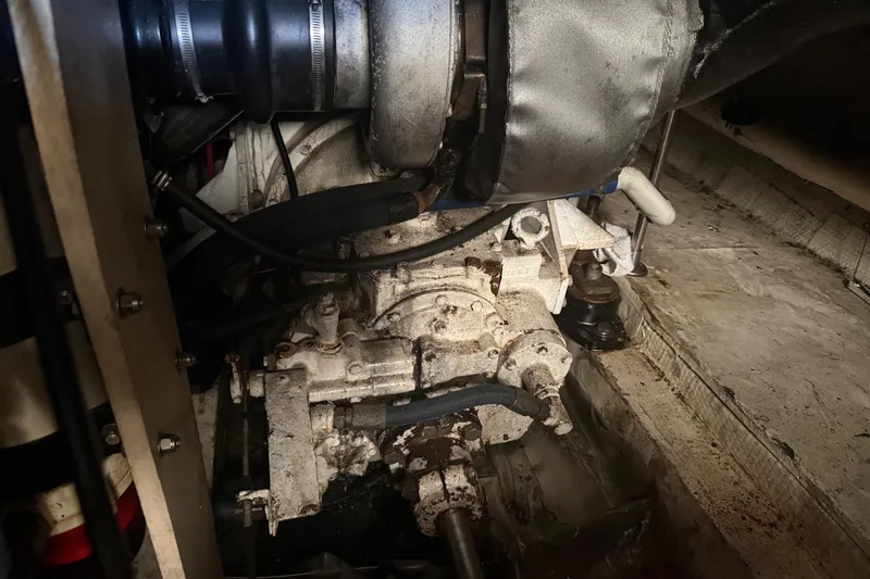 Slide: The Image of Engine compartment of a 1974 Pacemaker 48 Sportfisherman boat, showing mechanical components. - 49