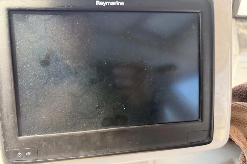 Slide: The Image of Raymarine display on 1974 Pacemaker 48 Sportfisherman, screen off, showing reflections. - 52